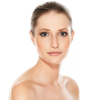 Portrait of a beautiful girl with tender skin over a white background